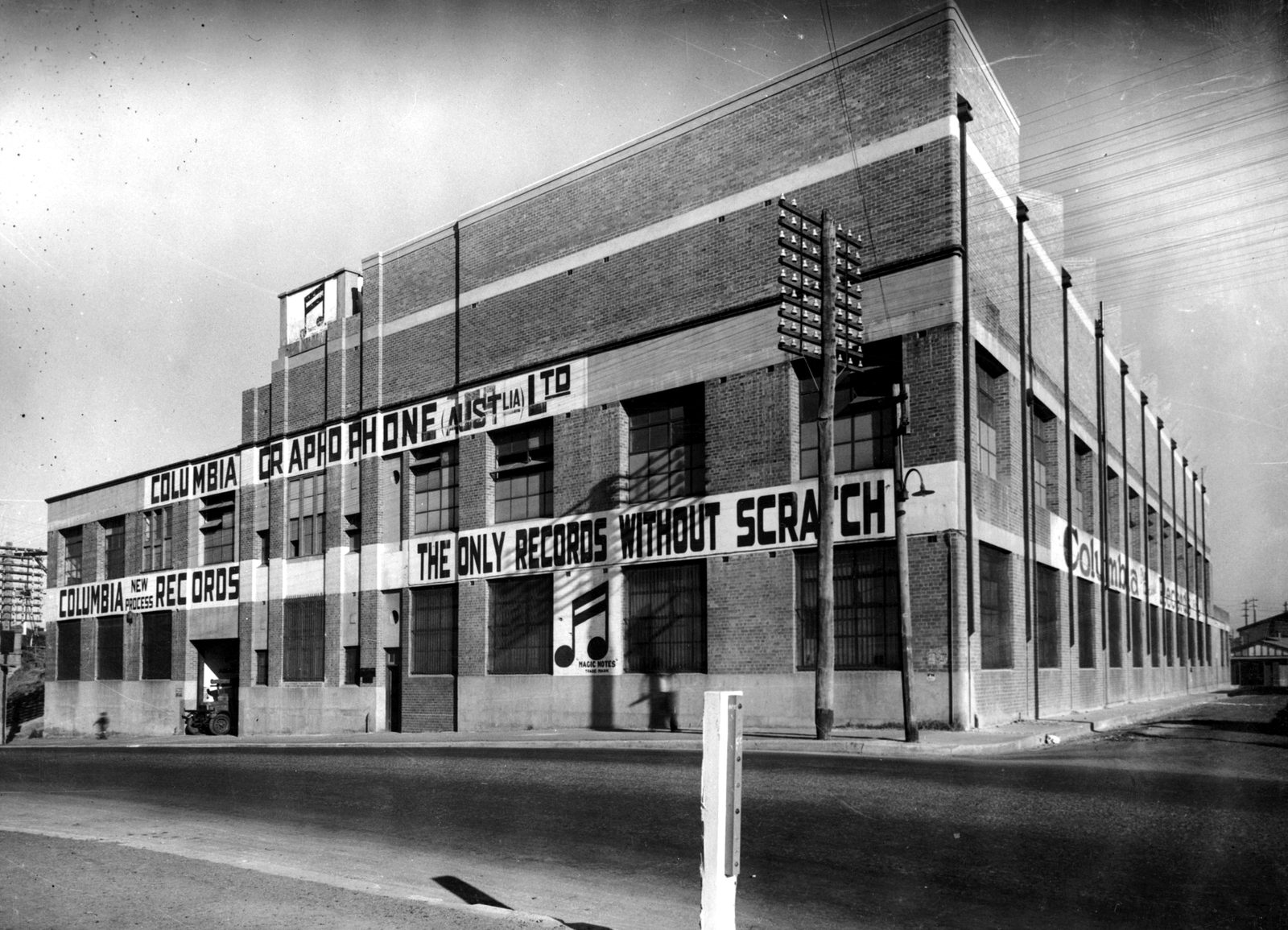 The Columbia Graphophone factory at Homebush around 1930, with 'The only records without scratch' painted across the front